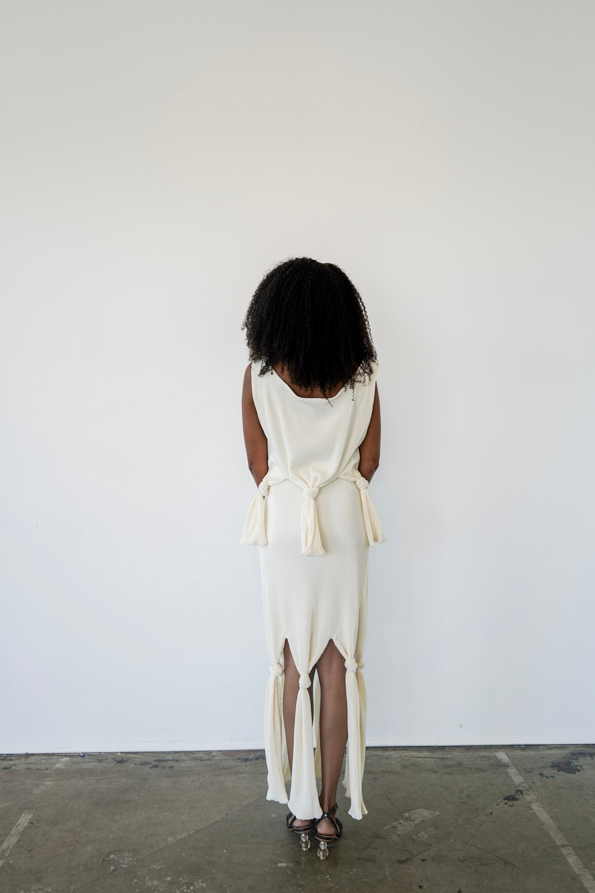Back view of Robin Top in ivory – pleated plissé crop top with open back and clean boat neckline
